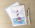 Hand painted watercolor island lighthouse greeting card with hand painted envelope. Card is blank inside for your own personal message.